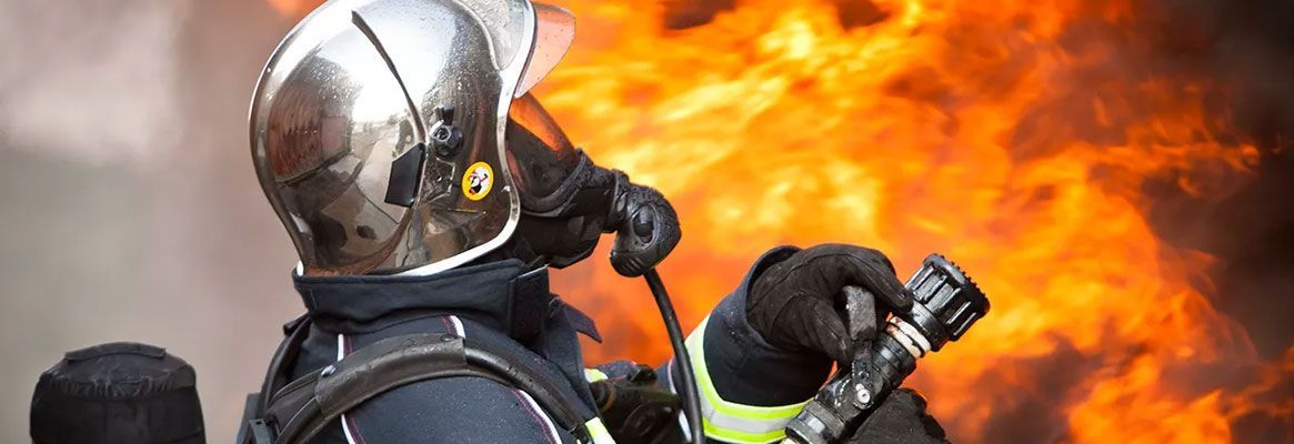 Thermal performance of fire fighters' protective clothing: Numerical study of transient heat and wat