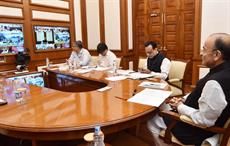 Indian finance minister Arun Jaitley (right) chairing the 27th GST Council Meeting, via video conference. Courtesy: PIB