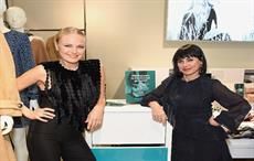 Malin Akerman and Constance Zimmer in front of H&M's in store Garment Collecting Bin