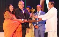 Brandix directors Ranga Ranmadugala and Dave Ranasinghe (L to R) accepting the award from President Maithripala Sirisena. Pic: Brandix
