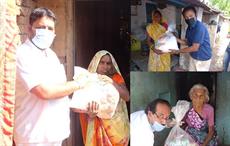 Chiripal Group employees distributing food grains and other items to people nearby their factories. Pic: Chiripal Group