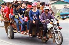Pic: Garment workers riding a ‘romork’ to work in Cambodia. Pic Chhor Sokunthea/World Bank