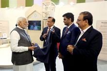 Recycled jacket being presented to PM Narendra Modi at Bharat Tex 2024 by (L-R) Bharat Tex chairman Narendra Goenka, co-chairman Bhadresh Dodhia, and secretary general Rakesh Kumar. Pic: Dodhia Group