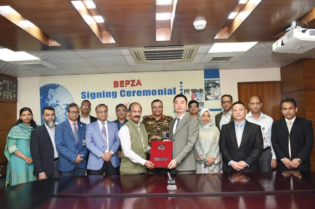 Director of Kaixi Lingerie Bangladesh Xiao Hongxi with BEPZA representatives at the signing ceremony. Pic: BEPZA