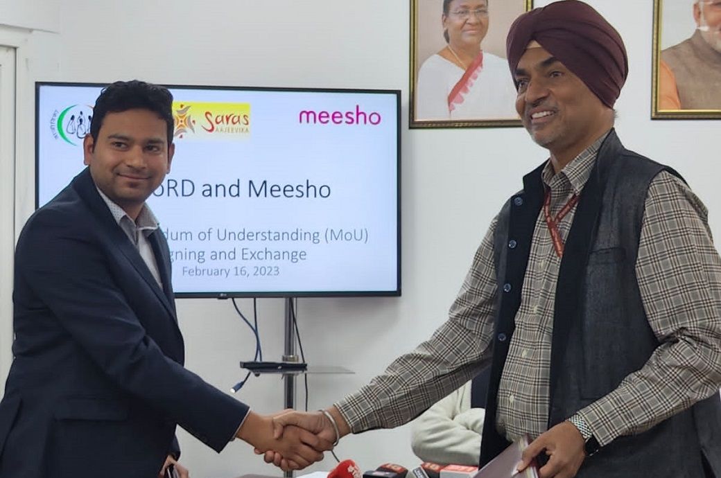 Sanjeev Barnwal (L), co-founder and CTO, Meesho, and a representative of the Indian ministry of rural development at the signing of the Memorandum of Understanding (MoU) in Delhi.