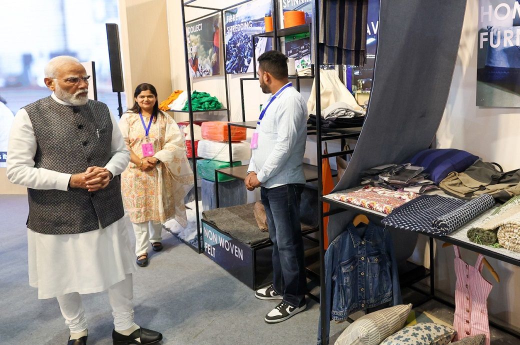 Prime Minister Narendra Modi during a walkthrough of the textile exhibition showcased on the 