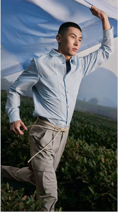 A person wearing a blue shirtDescription automatically generated