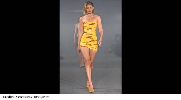 A person in a yellow dress

Description automatically generated