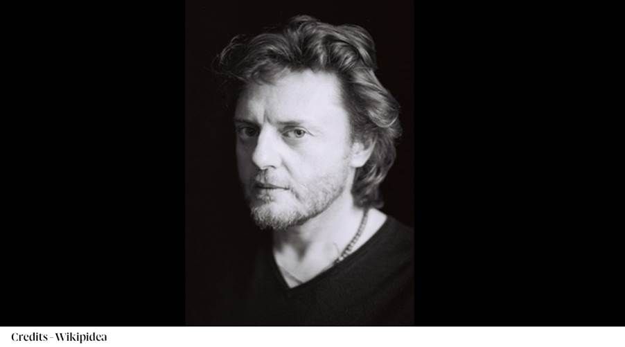 A person with a beard
Description automatically generated