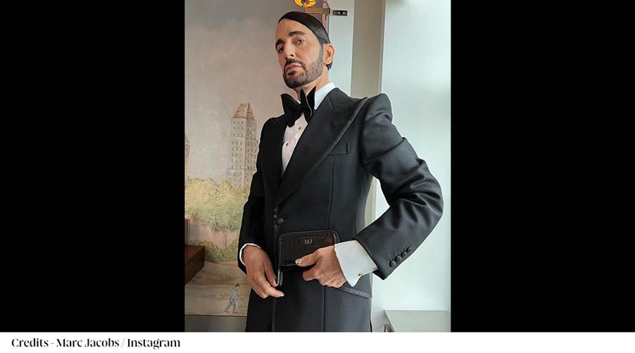 A person in a suit
Description automatically generated