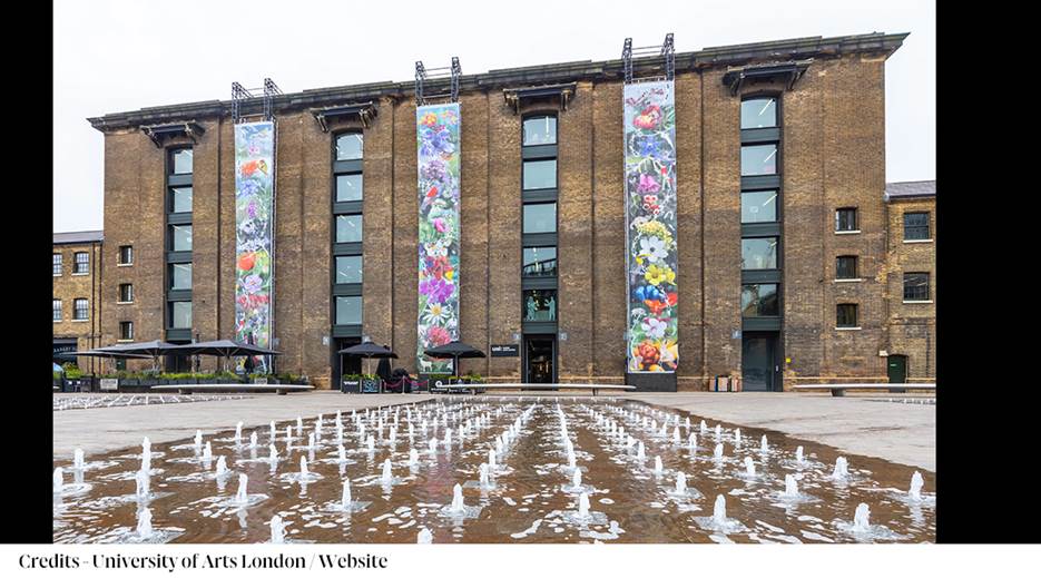 A building with a fountain in front of it
Description automatically generated