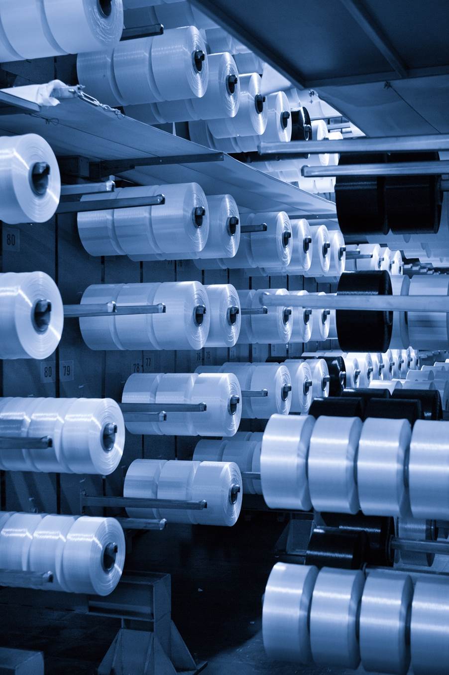 Rolls of plastic rolls in a factory
AI-generated content may be incorrect.