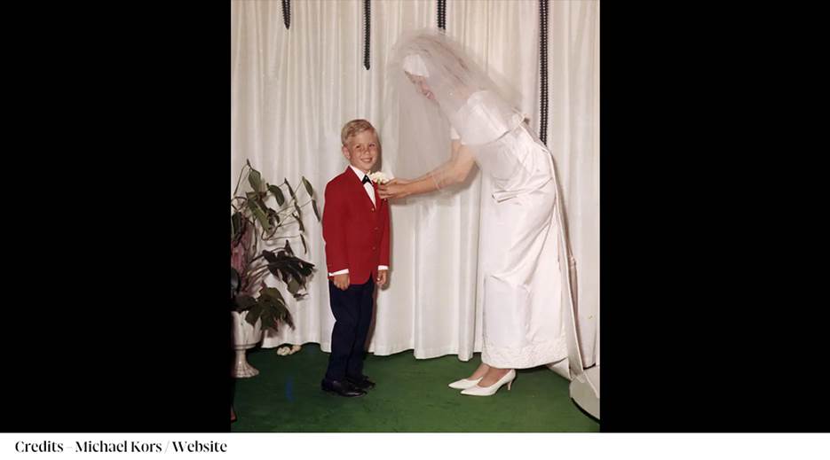 A person in a white dress and veil putting on a child's bow tie

AI-generated content may be incorrect.