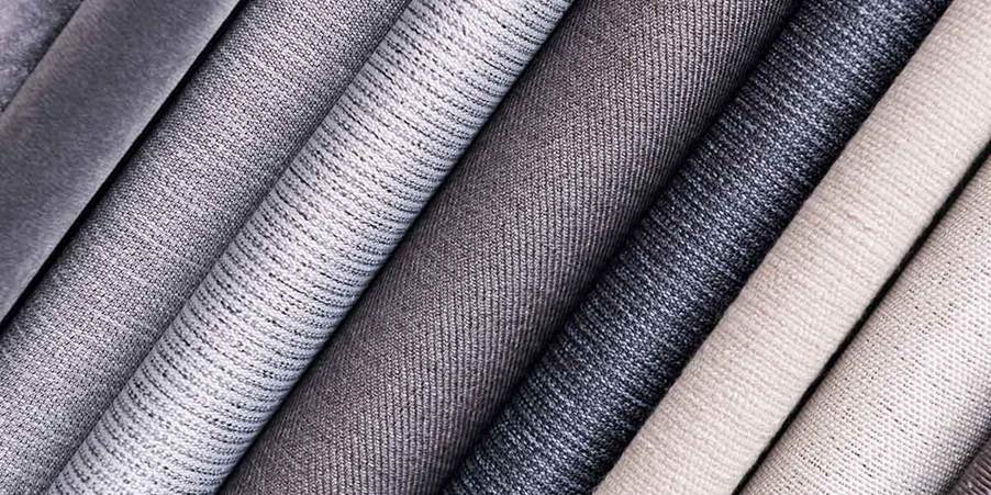 A close-up of several rolls of fabric
AI-generated content may be incorrect.