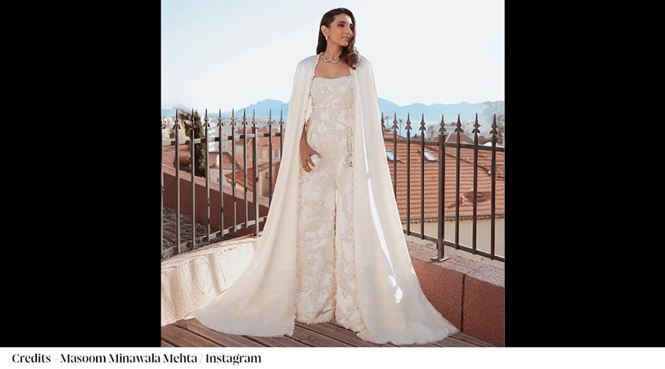 A person in a white dress with a cape AI-generated content may be incorrect.
