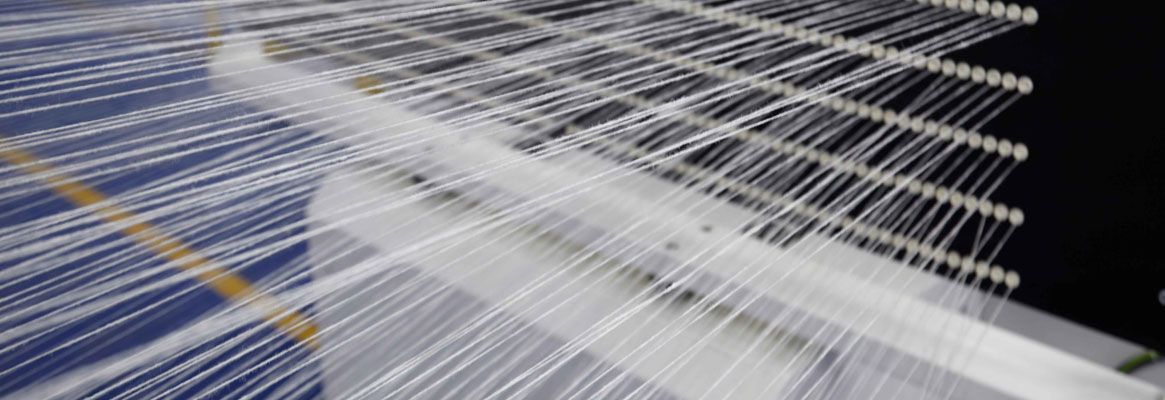 Real-time fabric defect detection and control in weaving processes