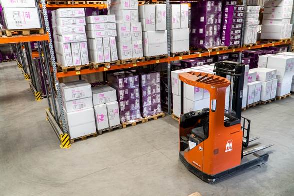 A picture containing text, floor, indoor, warehouse
Description automatically generated