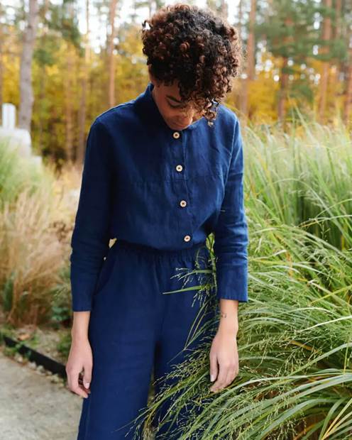 A person wearing a blue coatDescription automatically generated with low confidence