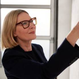 A person wearing glassesDescription automatically generated with medium confidence