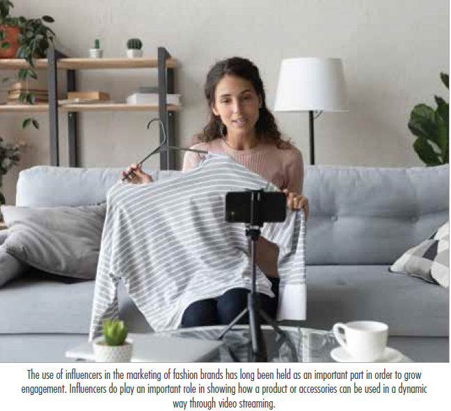 A person holding a cameraDescription automatically generated with medium confidence