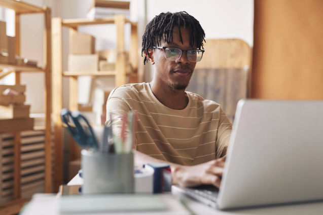 A person working on the computerDescription automatically generated with medium confidence