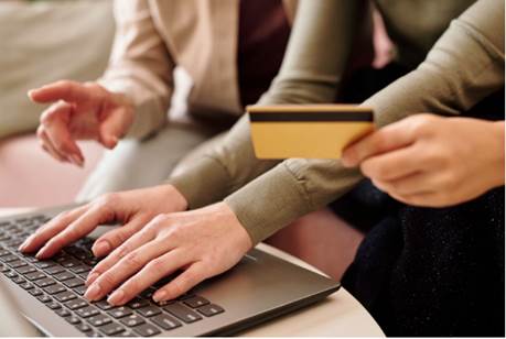 Close-up of people working on a computer
Description automatically generated with medium confidence