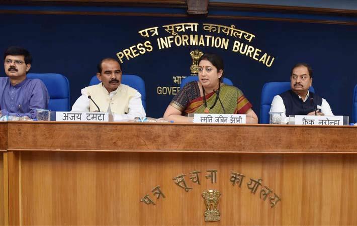 Textiles minister Smriti Irani at a press conference with minister of state for textiles, Ajay Tamta, the principal director general (M&C), PIB, AP Frank Noronha and other dignitaries. Courtesy: PIB