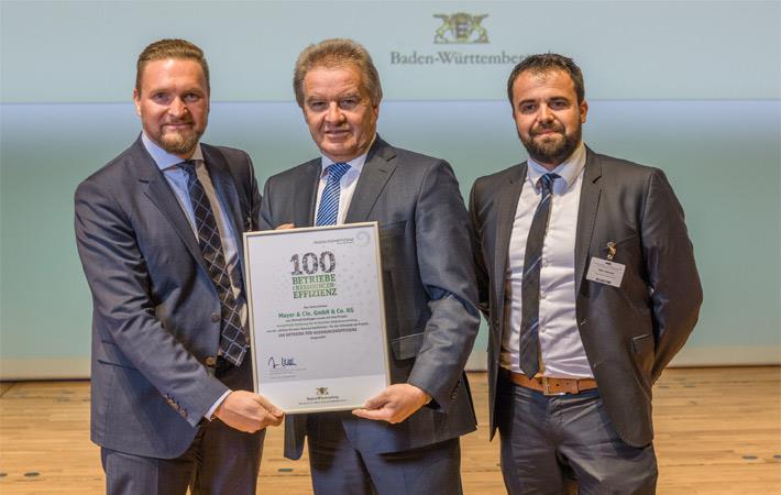 Franz Untersteller (centre) presenting the award to Marcus Mayer, MD of Mayer & Cie. (left), and Heiko Hämmerle, head of plant technology at Mayer & Cie. Courtesy: Stefan Longin