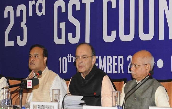 Indian finance minister Arun Jaitley (centre) addressing a press conference after the 23rd GST Council meeting in Guwahati. Courtesy: PIB