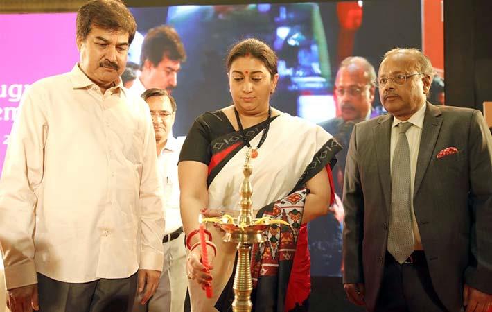 Textiles minister Smriti Irani lighting the lamp to inaugurate the 6th edition of the International Apparel and Textile Fair 