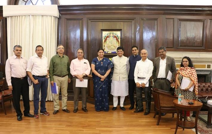 Textiles minister Smriti Irani (5th from left), Finance minister Piyush Goyal (5th from right) and others. Courtesy: AEPC