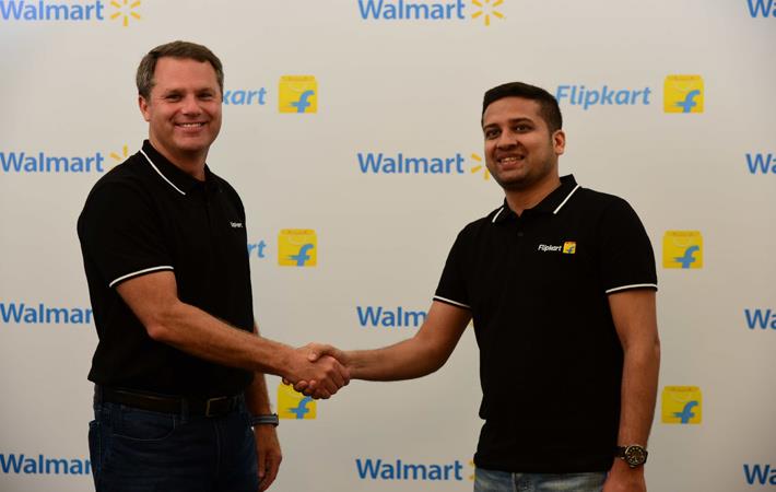 Walmart president and CEO Doug McMillon (left) with Binny Bansal, Flipkart