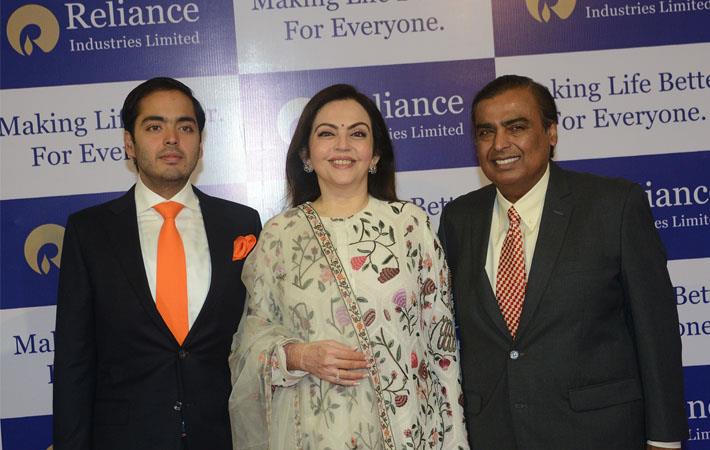RIL chairman Mukesh Ambani (right) with wife Neeta Ambani and son Anant Ambani at the 41st AGM of RIL. Courtesy: RIL