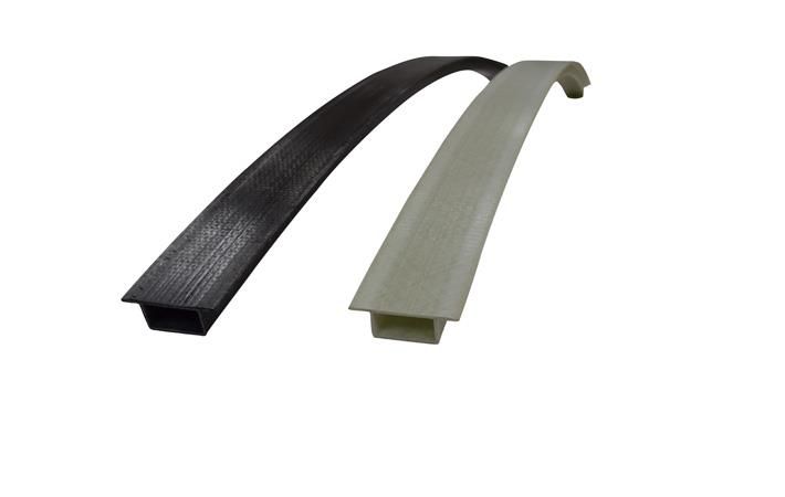 Curved lightweight bumpers made out of carbon and glassfibre using the Radius Pultrusion process./Pic: TTI