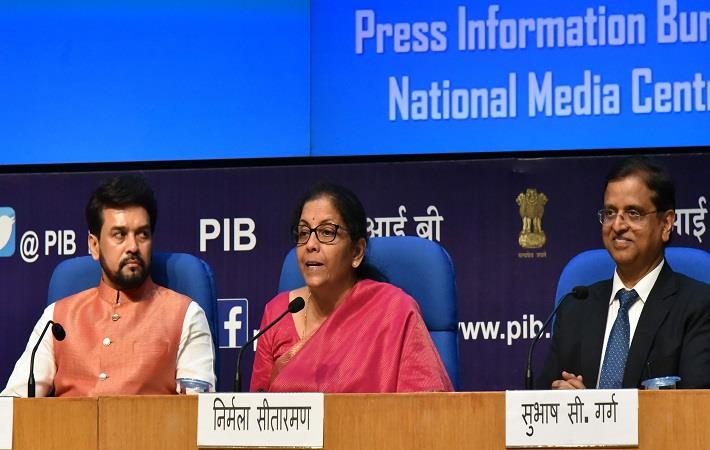 Union finance minister Nirmala Sitharaman addressing a post-Budget press conference in New Delhi. She is flanked by MoS finance Anurag Thakur (left) and secretary finance SC Garg. Pic: PIB