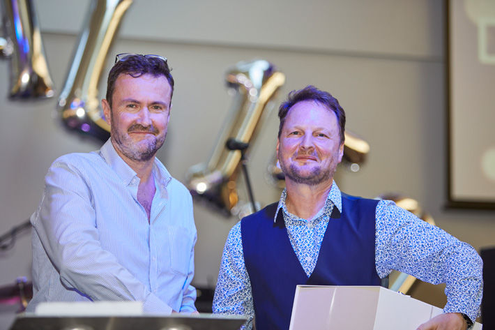 Neil Pryke receiving his long service award from John Page, PPT Group MD. Pic: James Heal